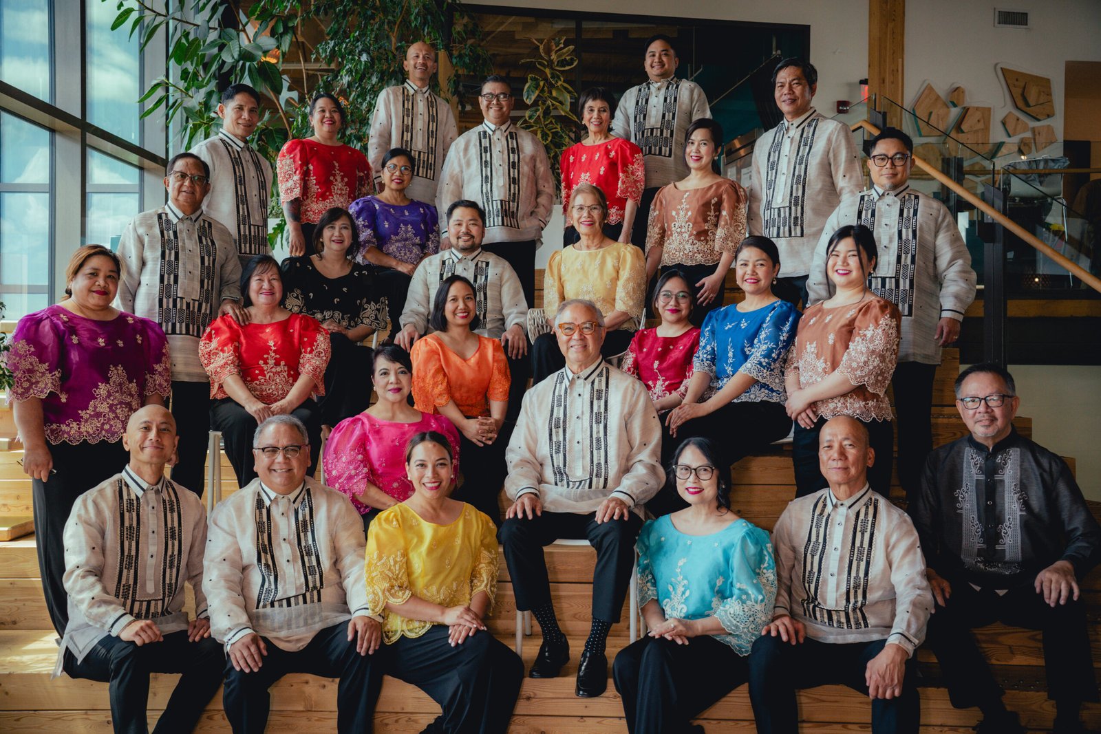 koro filipiino members in colored kimonas and barongs
